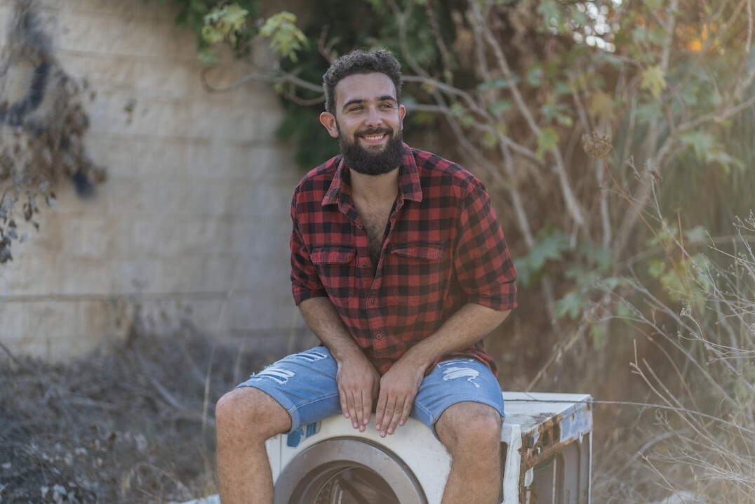 Smiling man with beard in casual shirt portrait