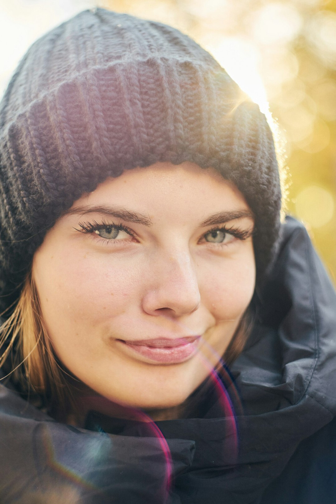 Young woman with warm smile portrait