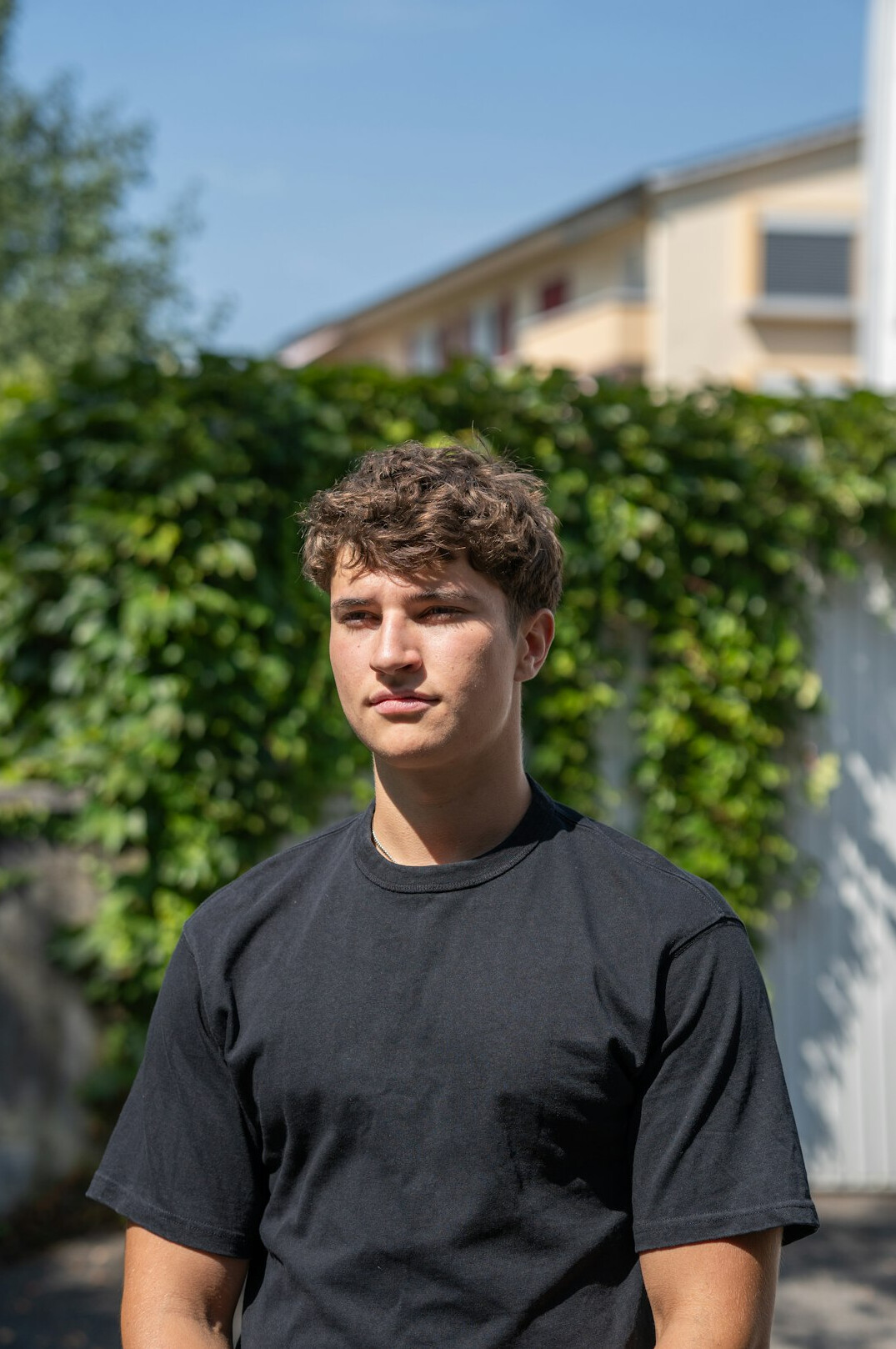 Confident young man smiling portrait outdoors